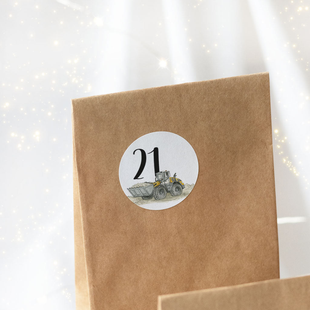 Sticker Nummer 21 mit einem Radlader klebt auf einem Tüten Weihnachtskalender