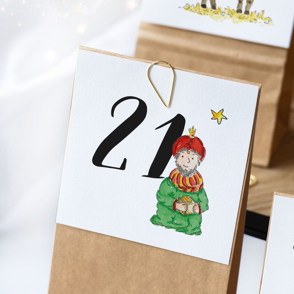 Karte mit Zahl Nummer 21 und einem der heiligen drei Könige