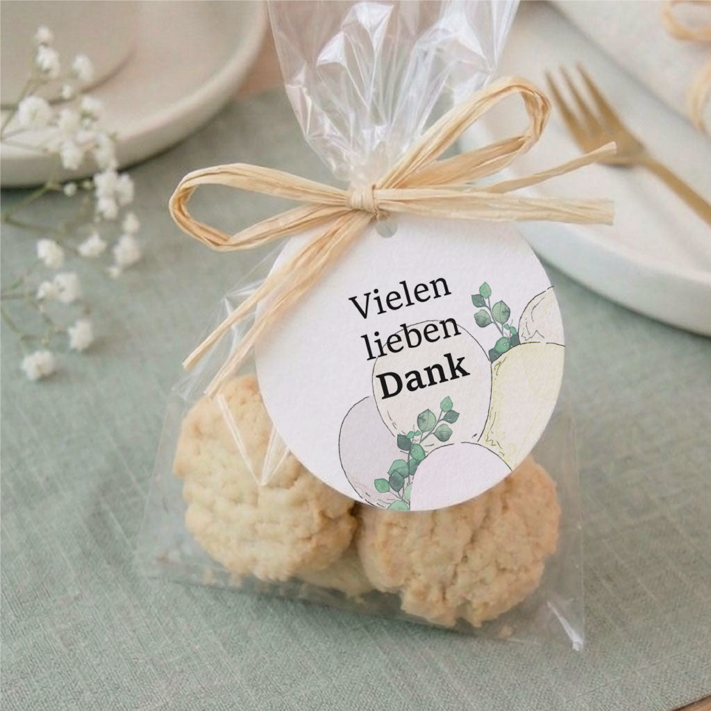 Gastgeschenk zur Taufe mit Keksen in Folie und Anhänger mit Luftballon Aquarell Motiv zum Danke sagen.