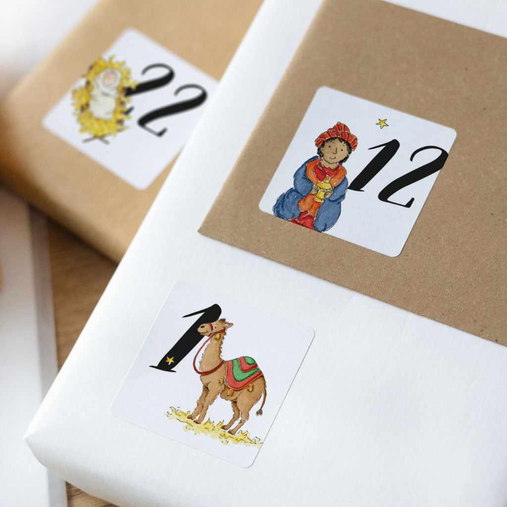 Adventskalender Zahlen mit der Weihnachtsgeschichte, hier Kamel, einer der heiligen drei Könige und Jesus in Krippe
