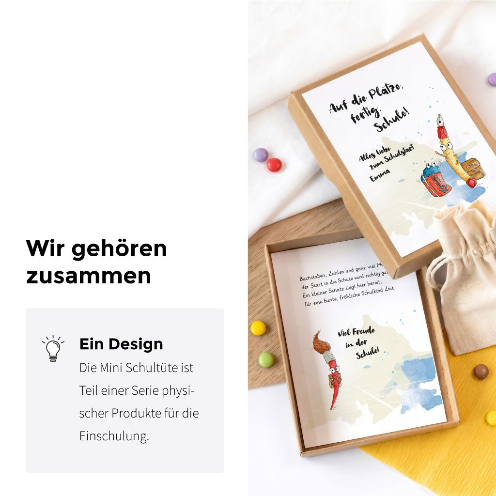 Geöffnete Geschenkbox und Glückwunschkarte zur Einschulung ergänzt durch das Stifte Aquarell Motiv.