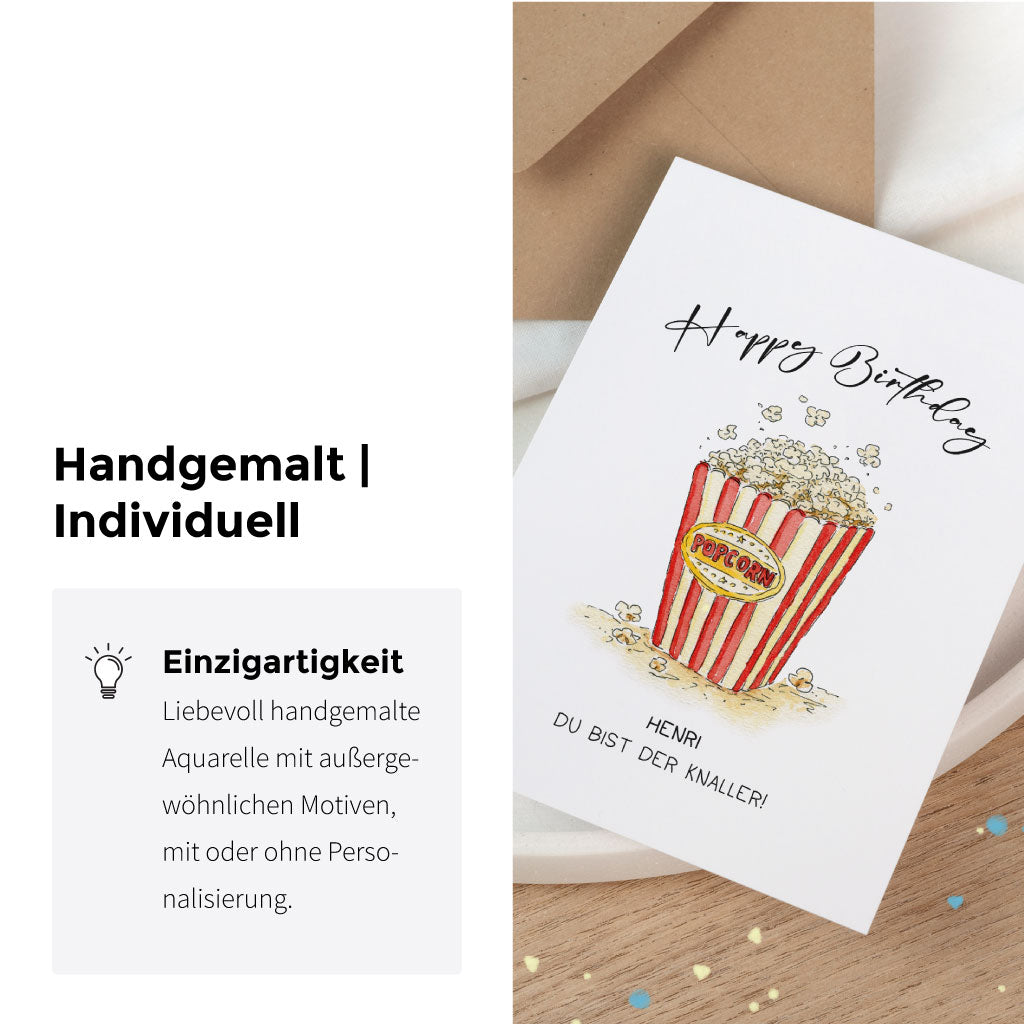 Detailansicht der handgemalten Geburtstagskarte mit Popcorn-Motiv im Zirkus-Design, kombiniert mit Wunschtext und Namenspersonalisierung.