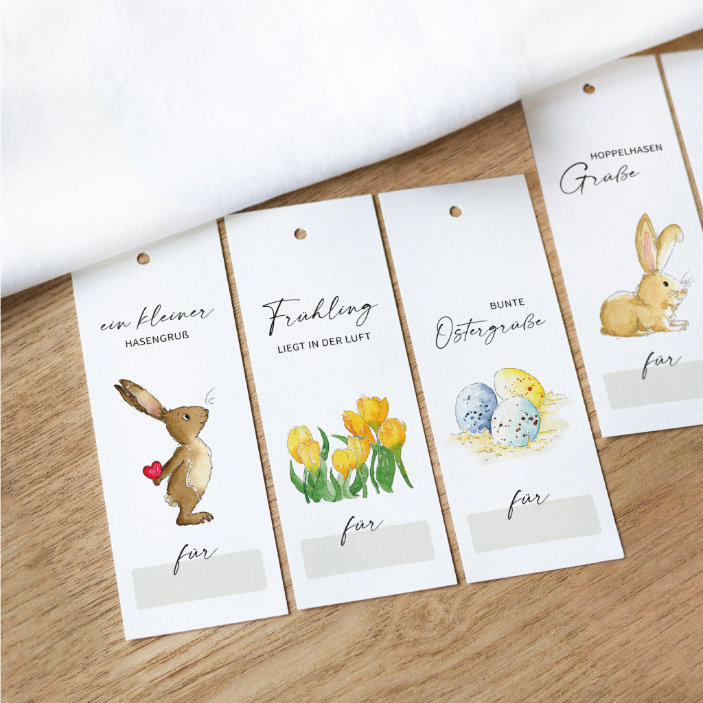 Große Geschenkanhänger zu Ostern mit handgemalten Aquarellen von Osterhase, Ostereiern und Frühlingsblumen – ideal zum Beschriften und als liebevolle Osterdekoration.