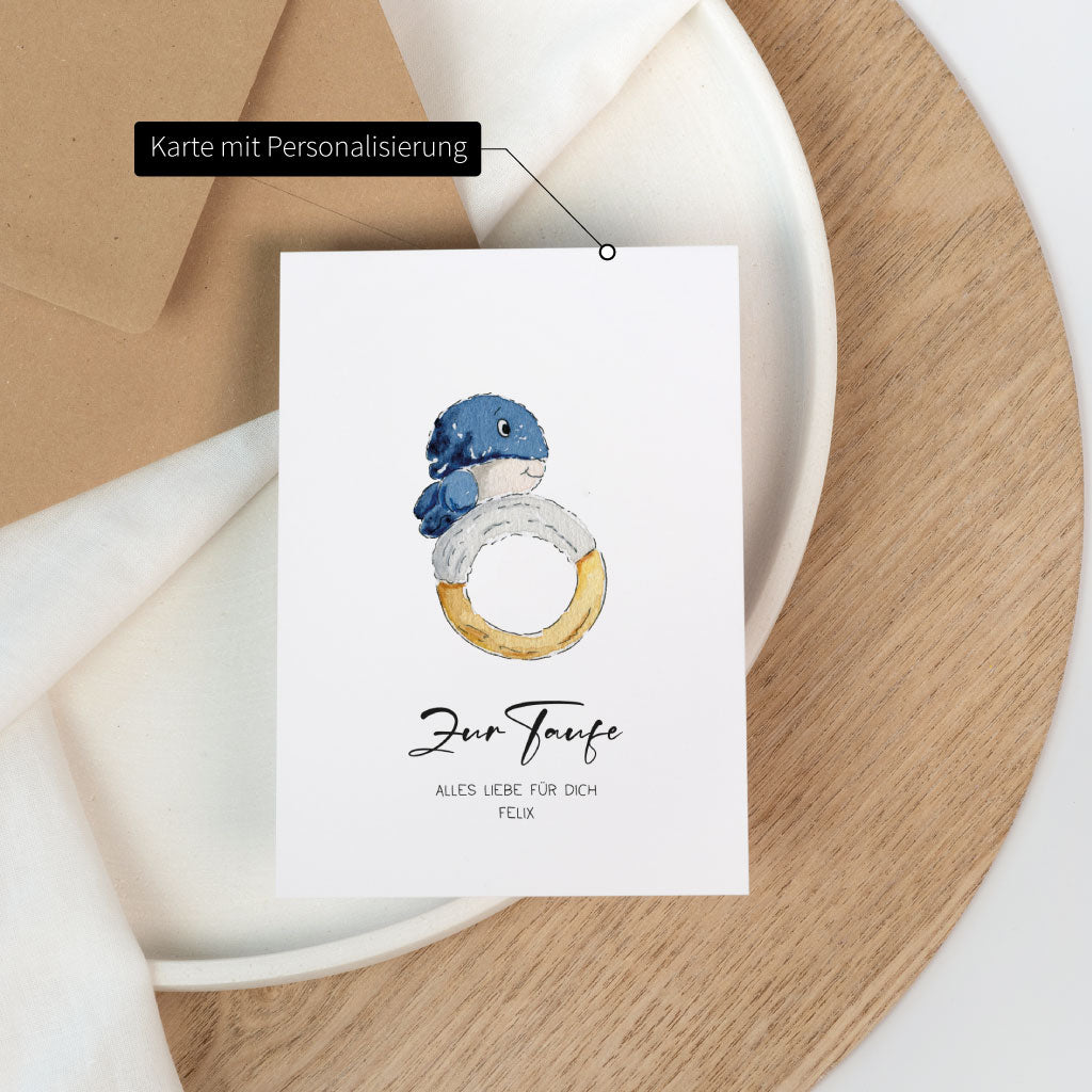 Personalisierbare Karte zur Taufe mit Name Felix und handgemaltem Wal auf weißer Klappkarte