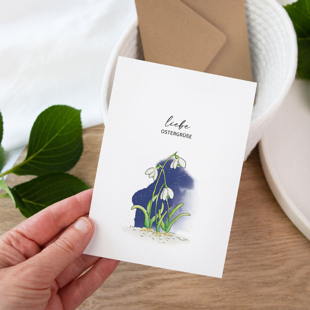 Osterkarte als Klappkarte mit Schneeglöckchen Aquarell und liebe Ostergrüße, frühlingshafte Aquarell Postkarte für das Osterfest.