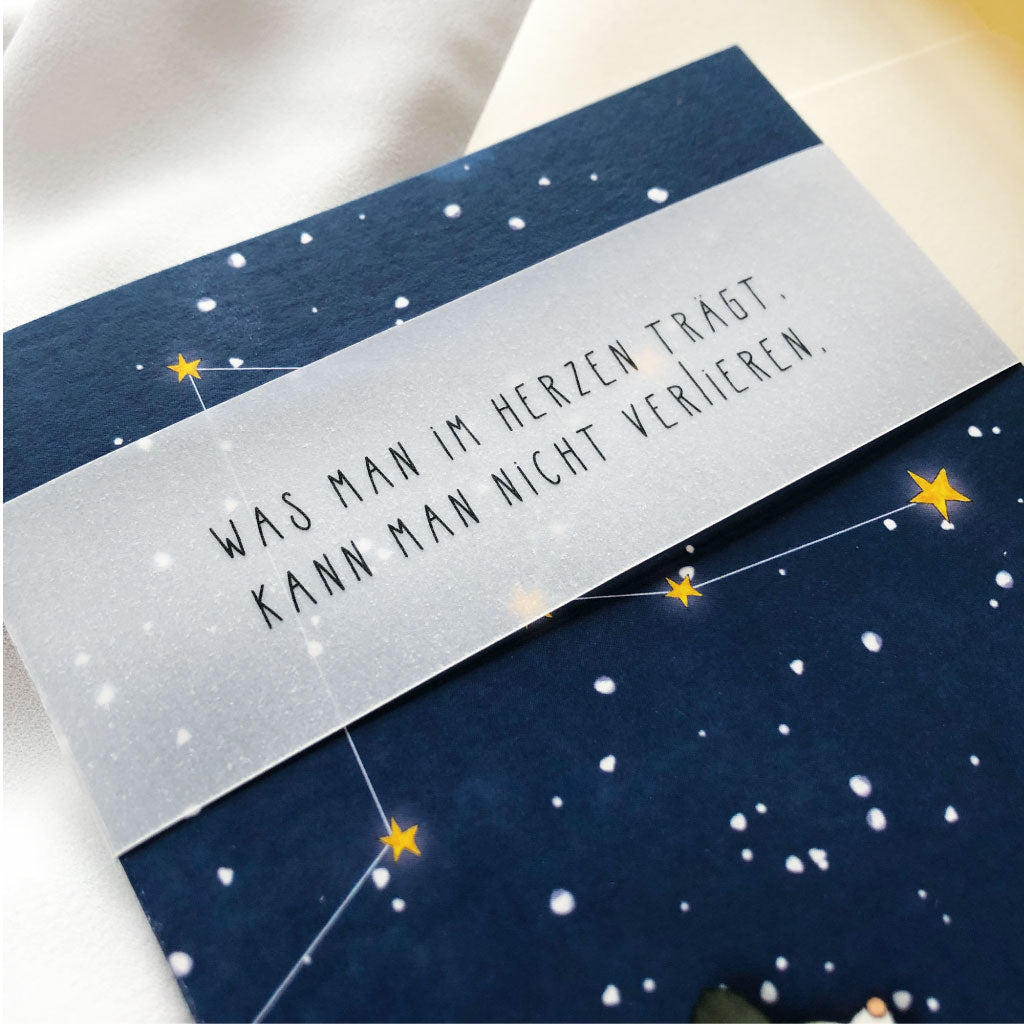 Banderole aus Transparentpapier mit Spruch "Was man im Herzen trägt, kann man nicht verlieren"