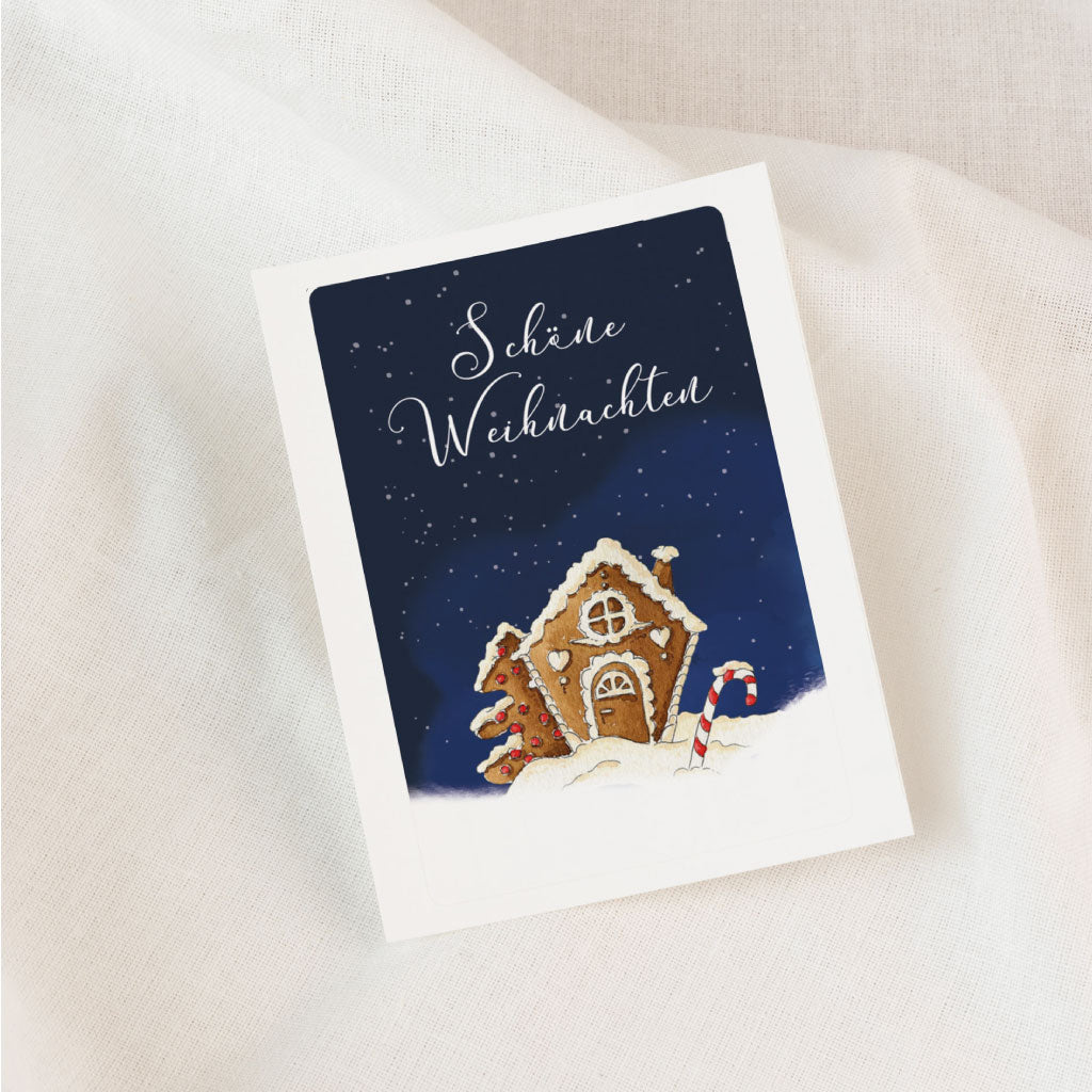 Nicht personalisierter Aufkleber für Grabkerzen im Advent, mit festlichem Lebkuchenhaus-Aquarell und Weihnachtsgruß in weißer Schrift.