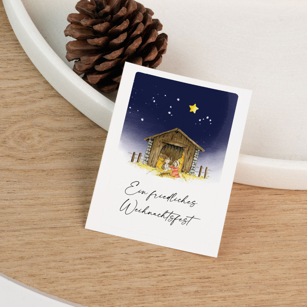 Handgemalter Aufkleber mit Aquarellmotiv von Maria, Josef und dem Jesuskind in der Krippe, ideal für Grabkerzen zu Weihnachten – liebevoll gestaltet für Kinder, Sternenkinder und Erwachsene.