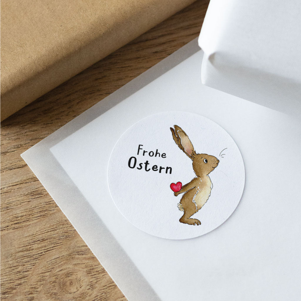 Runder Ostern-Aufkleber mit handgemaltem Aquarell-Osterhase und Schriftzug „Frohe Ostern“, ideal für Ostergeschenk Verpackung und Dekoration