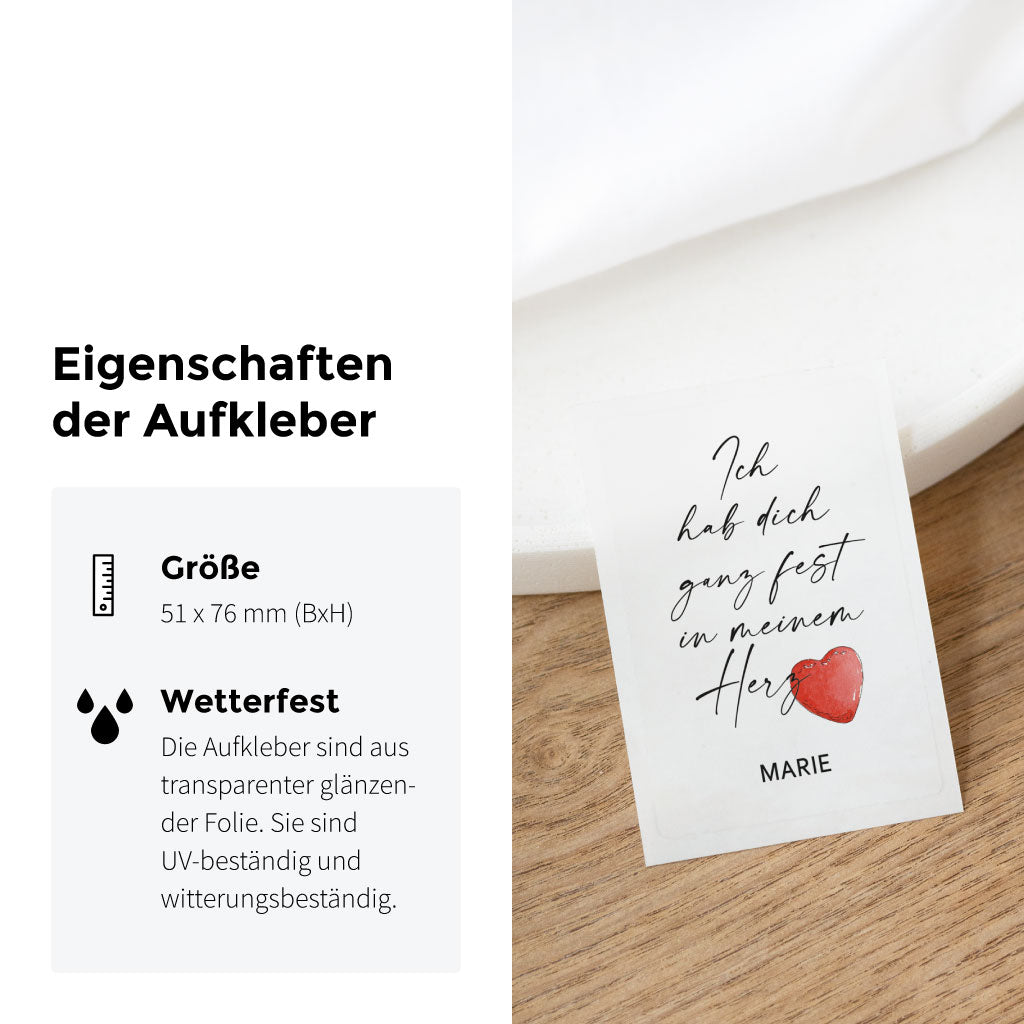 Produktfoto mit Größen- und Materialangaben: transparenter Aufkleber für Grabkerzen mit UV-beständiger, wetterfester Folie und liebevollem Aquarell-Herz.