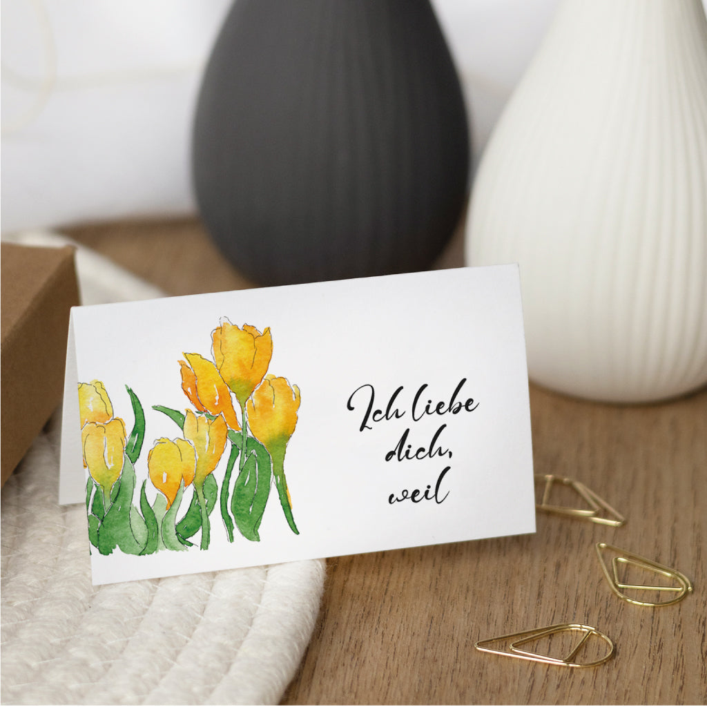 Einzelkarte mit gelben Tulpen und der Aufschrift „Ich liebe dich, weil“ – perfekte Idee für einen selbst geschriebenen Liebesbrief zum Valentinstag.