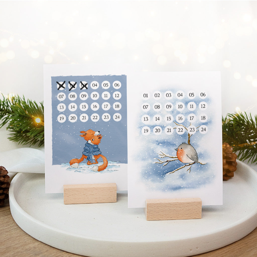 Kreativer Adventskalender zum Abhaken als Tischdeko mit Füchsen und Vogel im Schnee Aquarell Motiv auf Holzhaltern.