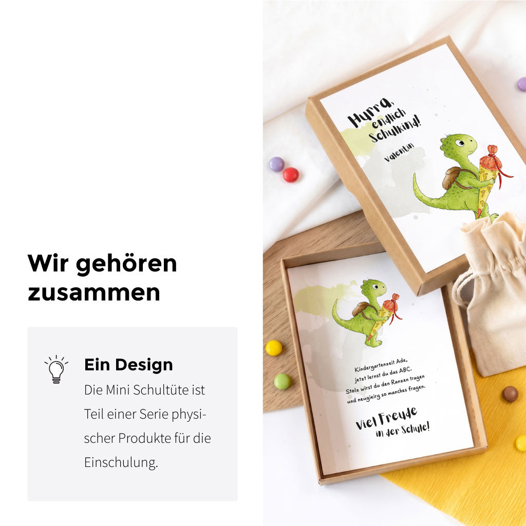 Geöffnete Geschenkbox und passende Karte mit Text Viel Freude in der Schule und Dinosaurier Aquarell Motiv.