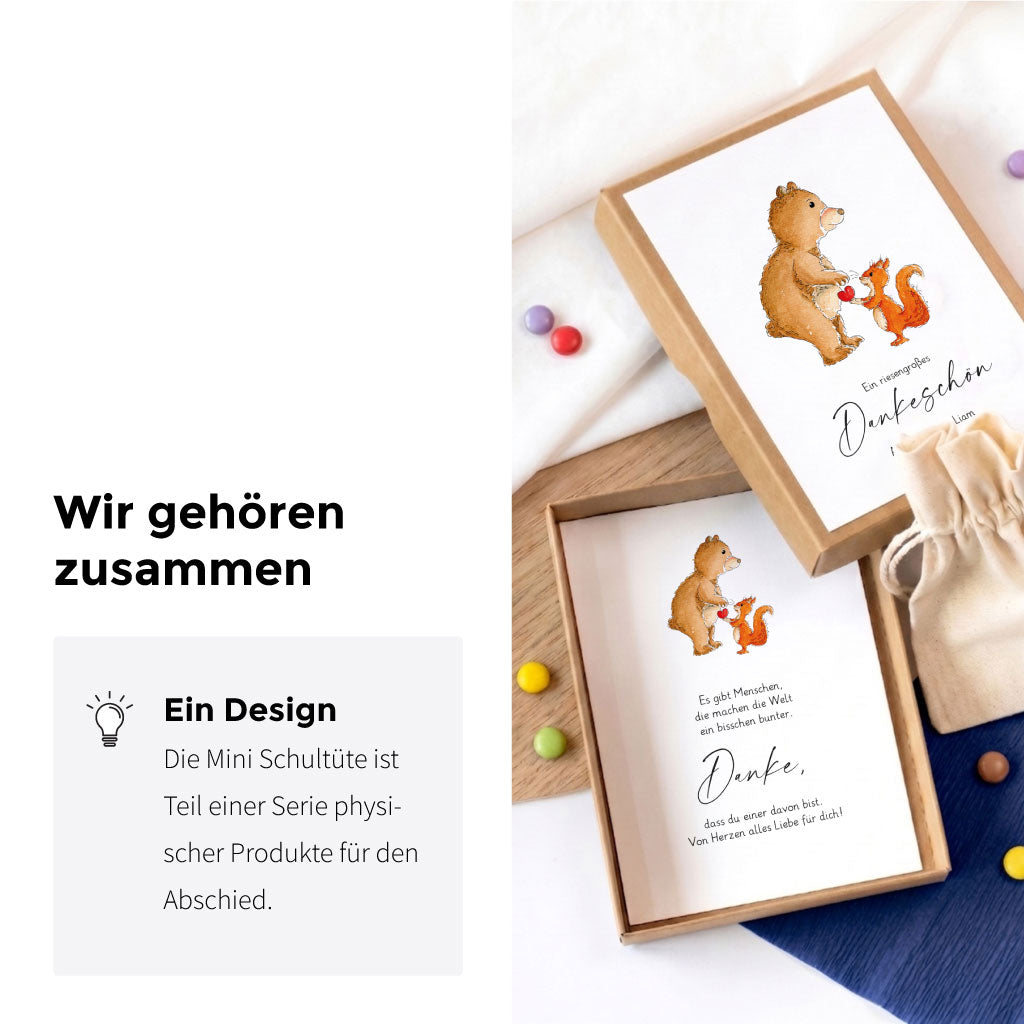 Geöffnete Geschenkschachtel zum Abschied mit passender Grußkarte und handgemaltem Bär und Eichhörnchen Aquarell Motiv.