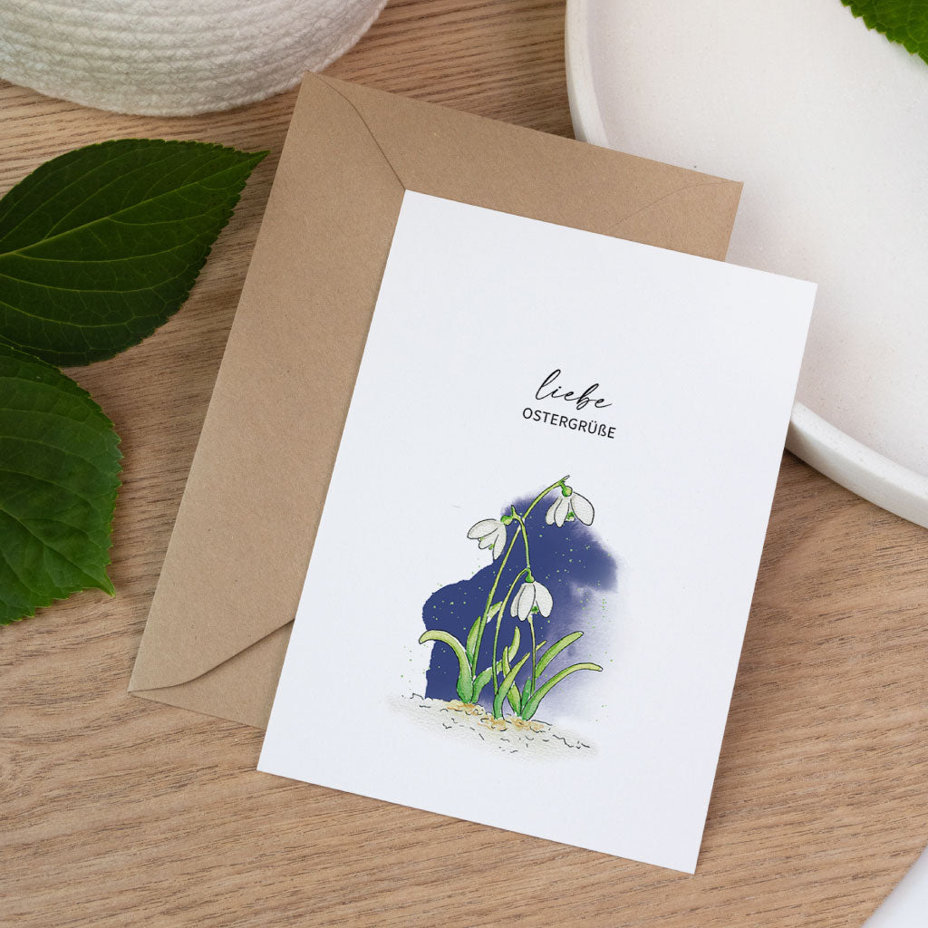 Handgemalte Aquarell Postkarte Ostern mit Schneeglöckchen als Frühlingsblumen Motiv, liebevoll gestaltete Osterkarte.
