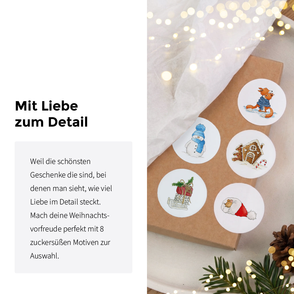 Fünf runde Aufkleber mit verschiedenen winterlichen Tiermotiven liegen dekorativ auf einem braunen Geschenkpaket.