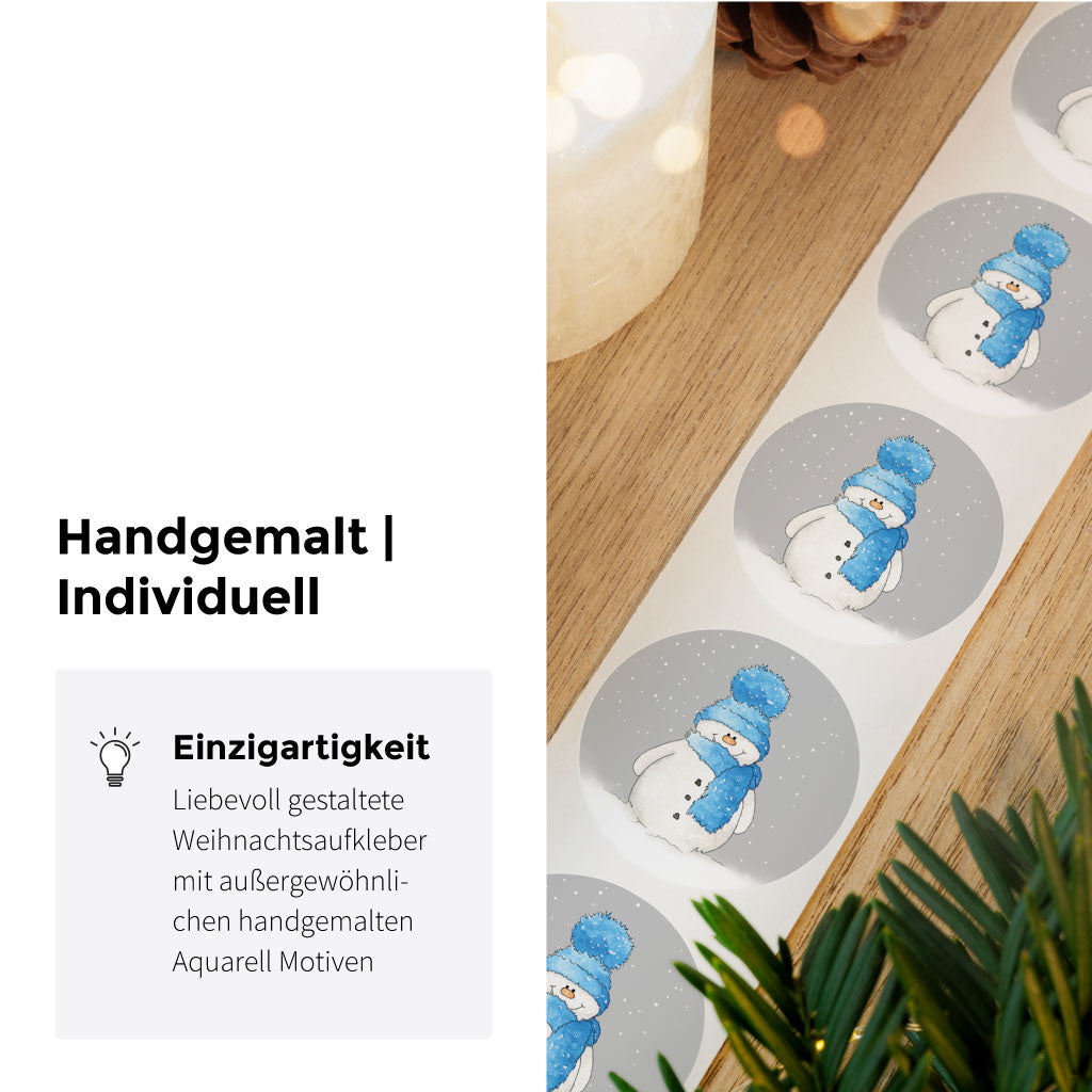 Rolle mit winterlichen Weihnachtsstickern, die liebevoll gestaltete Schneemänner im Aquarell-Design zeigen – perfekt zum Verpacken von Geschenken.