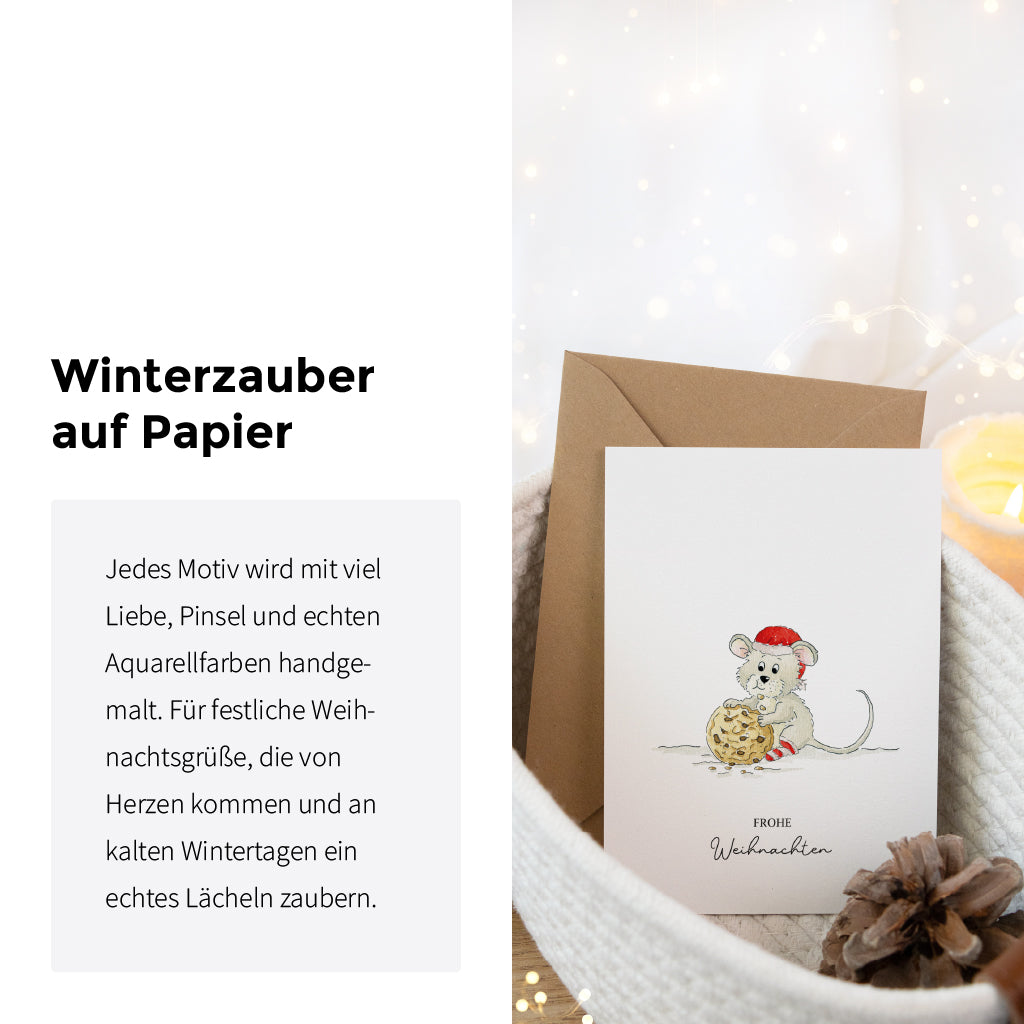 Detailansicht der Weihnachtskarte mit Maus Aquarell Motiv in einem Korb neben dem Schriftzug Winterzauber auf Papier.