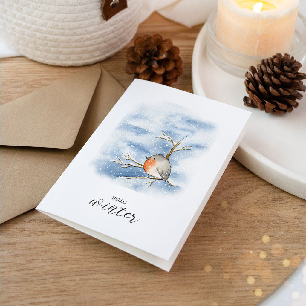 Künstlerkarte Weihnachten mit Aquarell Rotkehlchen auf Zweig, winterliche Klappkarte mit Umschlag