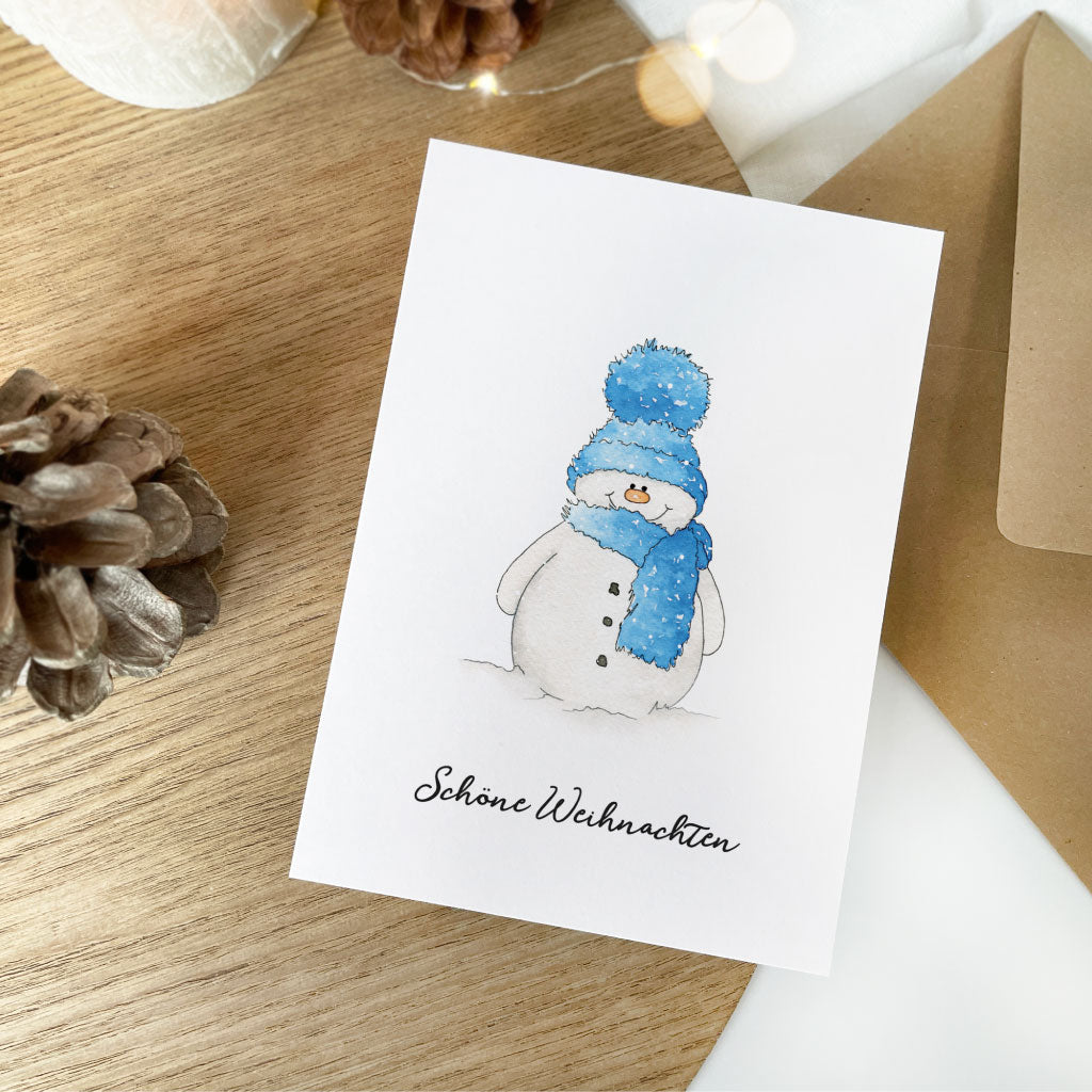 Weiße Weihnachtskarte mit Motiv Schneemann und Aufdruck "Schöne Weihnachten"